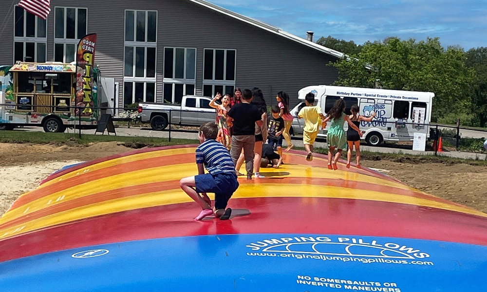 group of kids playing on the Jumping Pillow